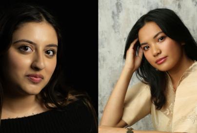 Side-by-side portrait photographs of Creative & Cultural Trainees Kiah Rihanna and Srea. On the left, Kiah looks towards the camera against a black background wearing a black top. On the right, Srea poses with her hand resting against her head, wearing a cream embroidered blouse against a textured light grey backdrop.