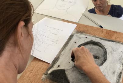 An image of a self-portrait being drawn