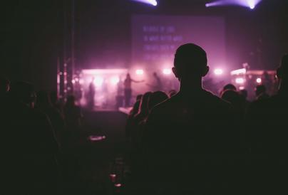 Live music silhouette of man watching a show